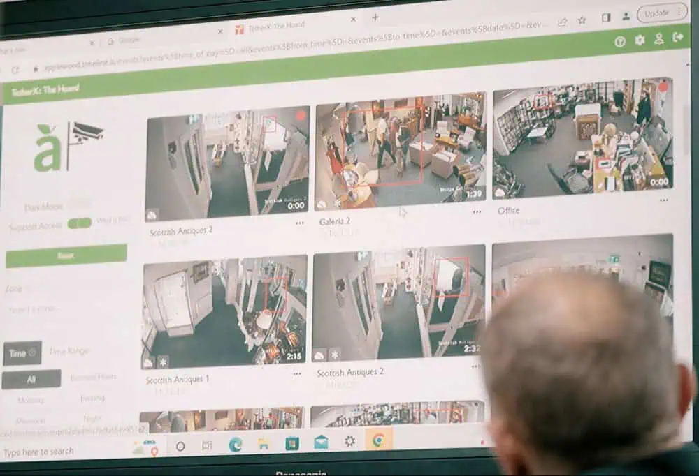 staff looking at monitor showing camera feeds